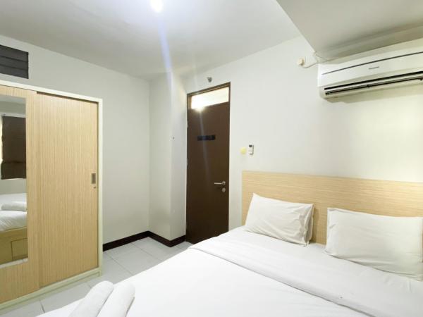 A la foto es mostra l'objecte Basic 2BR at Lagoon Bekasi Town Square Apartment By Travelio situat a la ciutat de Rawaroko.