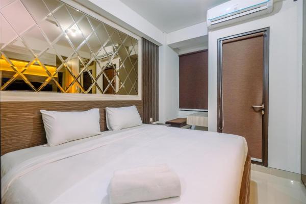 Warm And Minimalist Studio Room Transpark Cibubur Apartment By Travelio - Cibubur