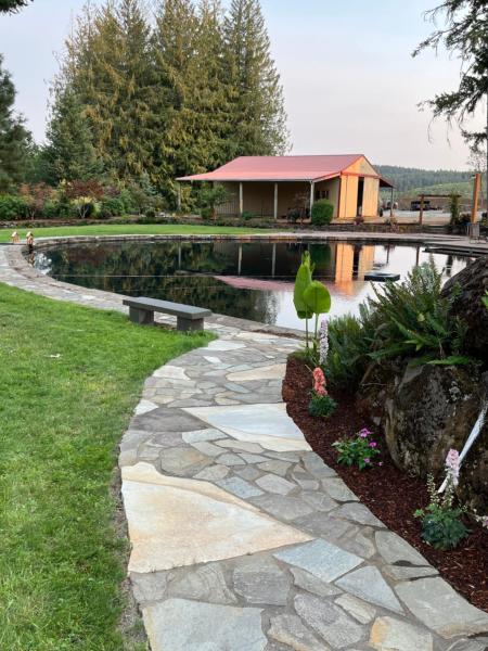 The photo shows the Collins Pond and Lodge located in the city of Scotts Mills.