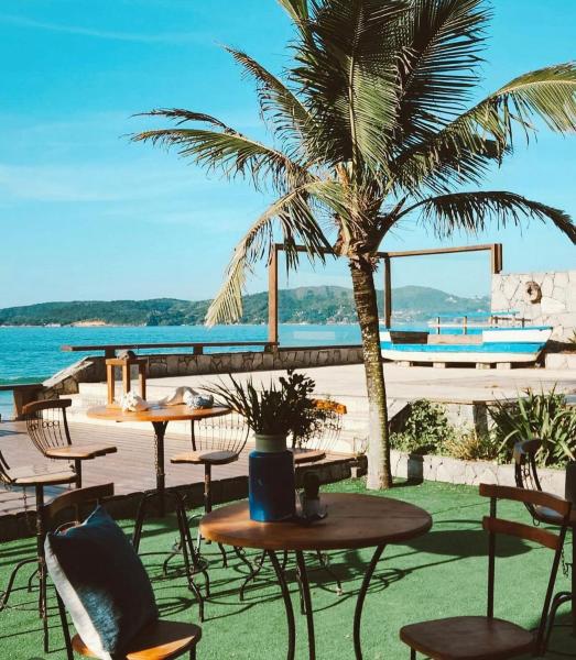 A la foto es mostra l'objecte Green Lounge – Casa Pé na Areia em Búzios situat a la ciutat de Búzios.