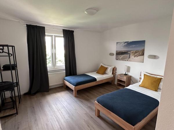 A la foto es mostra l'objecte Aparthotel 9 min to Dus Airport & 17 min to DUS Messe situat a la ciutat de Großenbaum.