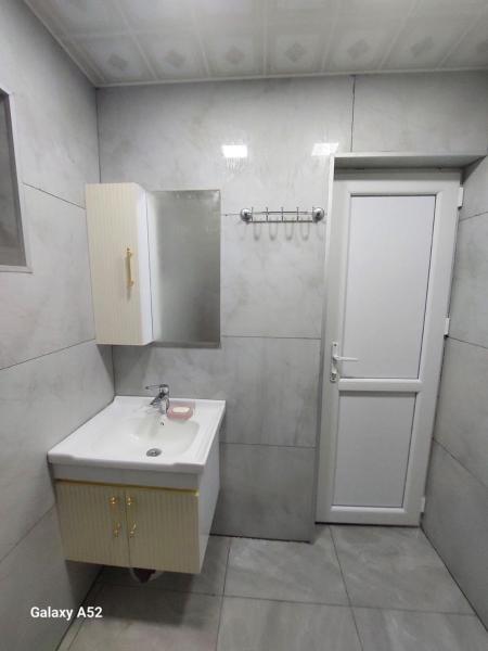 The photo shows the Tovuz , Esrikde aframe ev located in the city of Kiçik Qaramurad.