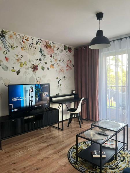 The photo shows the Apartament Andrea z balkonem located in the city of Dobroszyce.