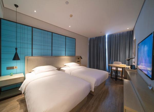 På billedet ses objektet Echarm Hotel Wuhan Caidian Street Linzhang Avenue Metro Station beliggende i byen Caidian.