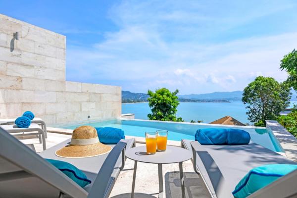 A la foto es mostra l'objecte BEACHSIDE VILLA - CARA - 3 BDR VILLA plus 1 BDR APARTMENT at SUNSET COVE BAY with SEA and MOUNTAIN VIEWS, 100 meters to the Swimming Beach situat a la ciutat de Amphoe Koh Samui.