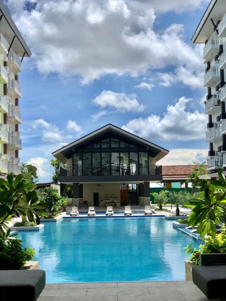 A la foto es mostra l'objecte Cozy and Sunny Apartment near to Mactan Cebu International Airport - Amani Grand Resort & Residences situat a la ciutat de Pusok.