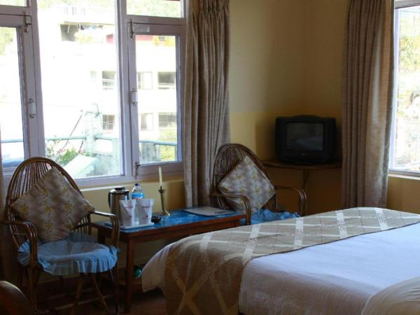 The photo shows the Fairmount Hotel located in the city of Pokhara.