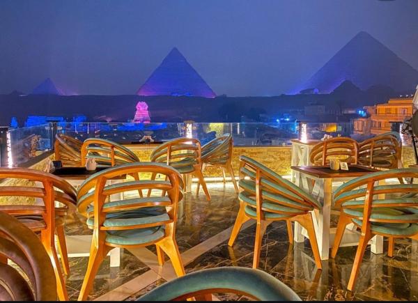 På billedet ses objektet Hotel Cleopatra Pyramids View beliggende i byen Kairo.