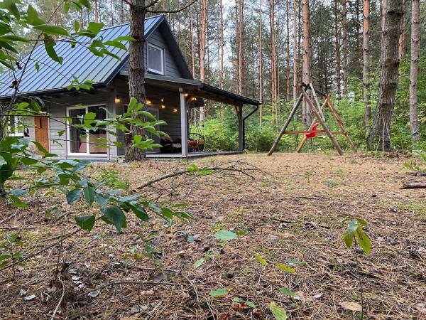 Na zdjęciu widoczny jest obiekt Leśny Domek Zelwa położony w mieście Stanowisko.