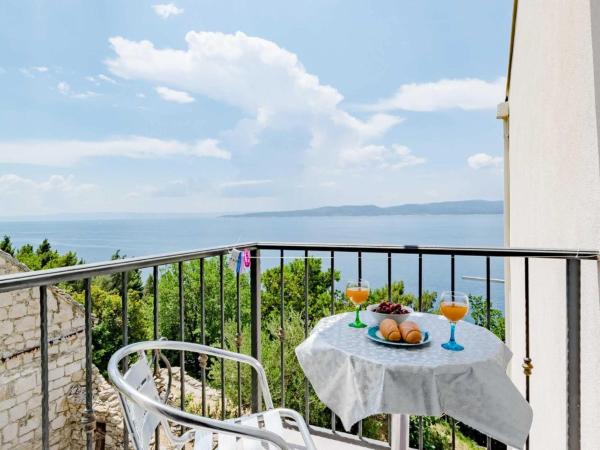 A la foto es mostra l'objecte Villa Kosa - Two Bedroom Apartment with Balcony and Sea View Roko situat a la ciutat de Brela.