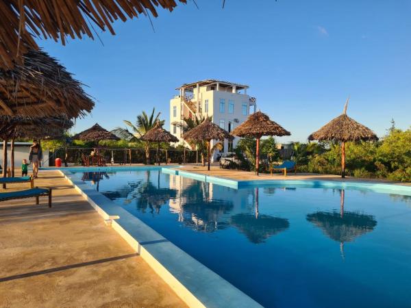 Na fotografii je vidět objekt Five Seasons Zanzibar opposite Mnemba island Hotel nacházející se ve městě Muyuni.
