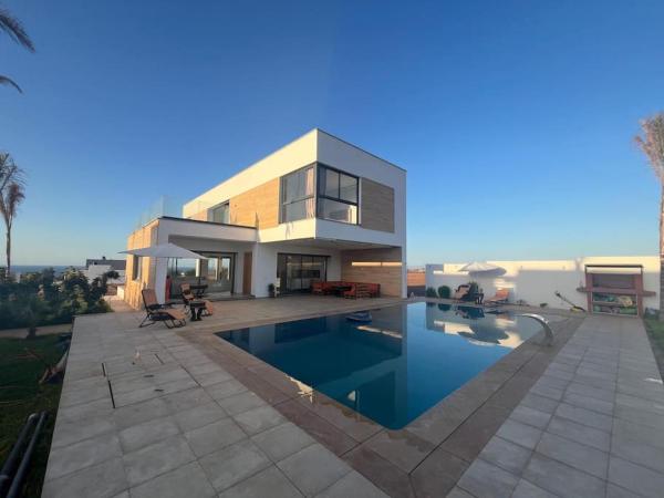 På billedet ses objektet Villa de plage avec piscine beliggende i byen Ifoutatsene.