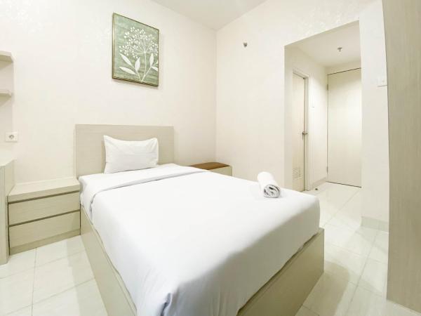 På billedet ses objektet Minimalist and Homey Studio Room at Amartha View Apartment By Travelio beliggende i byen Kendal.