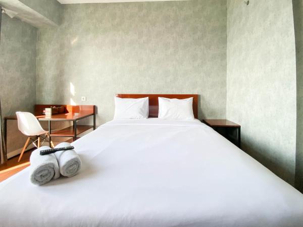Na fotografii je vidět objekt Homey and Good Choice Studio at Amartha View Apartment By Travelio nacházející se ve městě Brangsong.