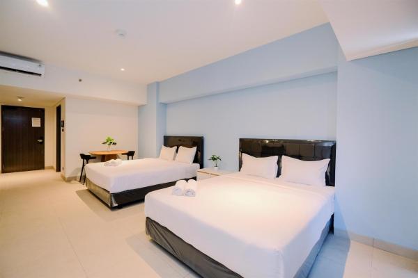 写真にはKramat市にあるBig Studio For 4 Pax Apartment at Carstensz Residence By Travelioが写っています。