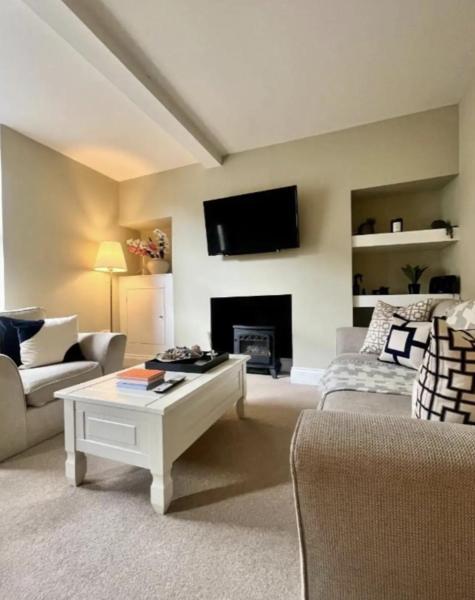 A la foto es mostra l'objecte Queens Cottage situat a la ciutat de Skipton.