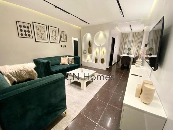 Op de foto is het object Stylish and Comfy 2 BR Apartment - Perfect for Families with PS5 te zien, gelegen in de stad Lagos.