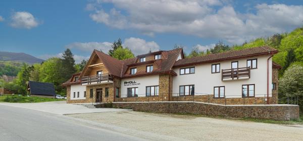 The photo shows the RHOLL Pension & Restaurant located in the city of Remetské Hámre.