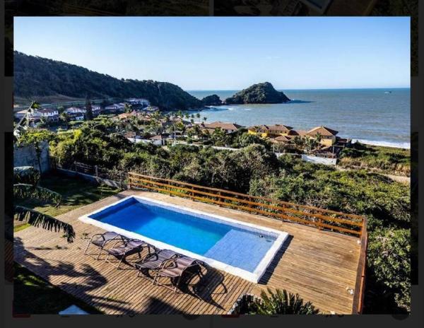 A la foto es mostra l'objecte Belíssima casa em Búzios com 04 suítes com vista para o mar, piscina e área gourmet situat a la ciutat de Búzios.