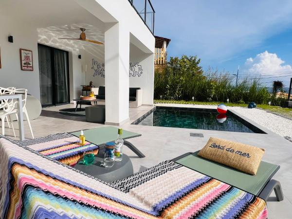 På bilden syns objektet Le BÔ Diamant Garden - appartement standing avec jardin, piscine et vue mer som ligger i staden Le Diamant.