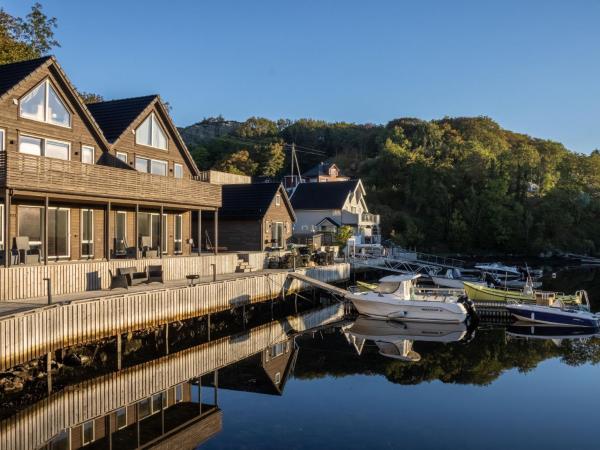 The photo shows the Holiday Home Lange by Interhome located in the city of Grutle.