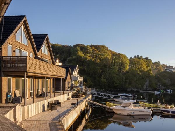 The photo shows the Holiday Home Torsk by Interhome located in the city of Grutle.