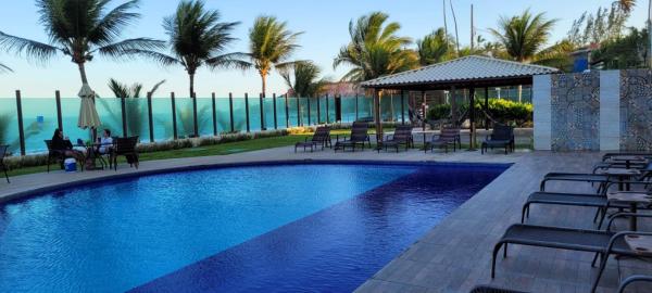 照片显示了位于Conde市的Flat Pé na areia - Residencial Tabatinga物件。
