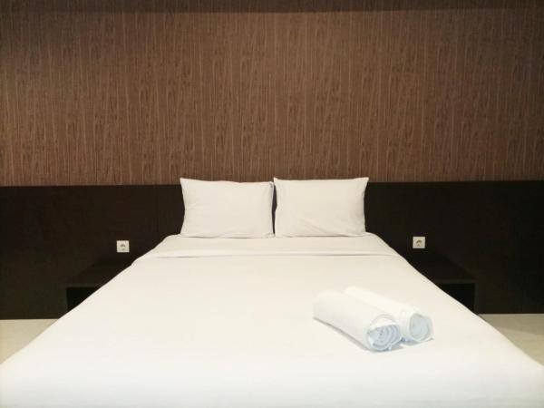 A la foto es mostra l'objecte Luxurious Studio at Mataram City Apartment By Travelio situat a la ciutat de Kejayan.