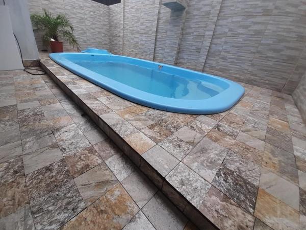 Na fotografii je vidět objekt Casa com piscina em Bertioga 700m da praia nacházející se ve městě Bertioga.