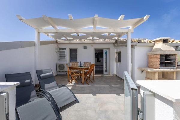 A la foto es mostra l'objecte Charming apartment in Punta Secca with sea view, 50 m² situat a la ciutat de Punta Secca.