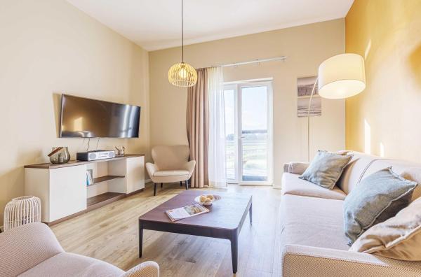 Na fotografii je vidět objekt Ankerplatz - 5 Sterne Ferienwohnung mit Blick auf die Ostsee nacházející se ve městě Wustrow.