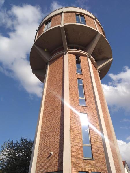 The photo shows the Watertoren - Chateau d'Eau located in the city of Steenokkerzeel.