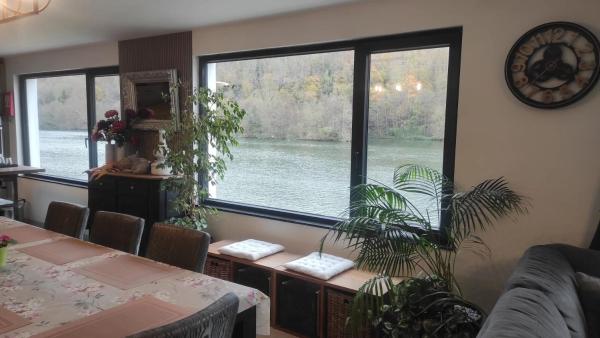 The photo shows the Charming Riverside House with Jacuzzi and Gym located in the city of Heer.