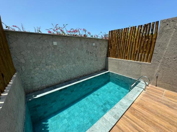 Na fotografii je vidět objekt Casa com piscina pertinho da Praia l Milagres Hospedagens nacházející se ve městě Pôrto de Pedras.