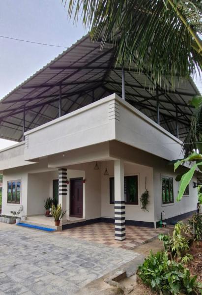 A la foto es mostra l'objecte Beens Inn Properties situat a la ciutat de Thodupuzha.