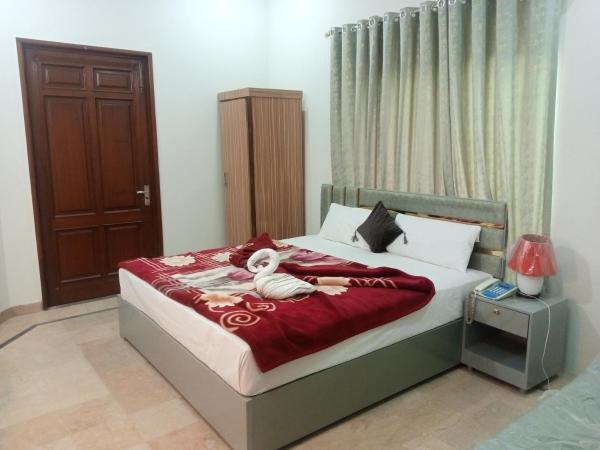 The photo shows the Hotel Business Boutique located in the city of Multan.