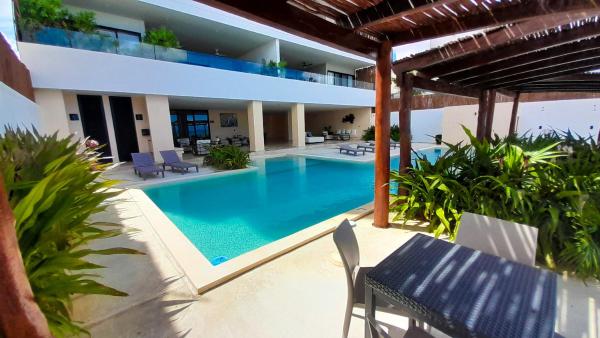 På billedet ses objektet Sifnos Spacious Apartment close Chicxulub beliggende i byen Chicxulub.