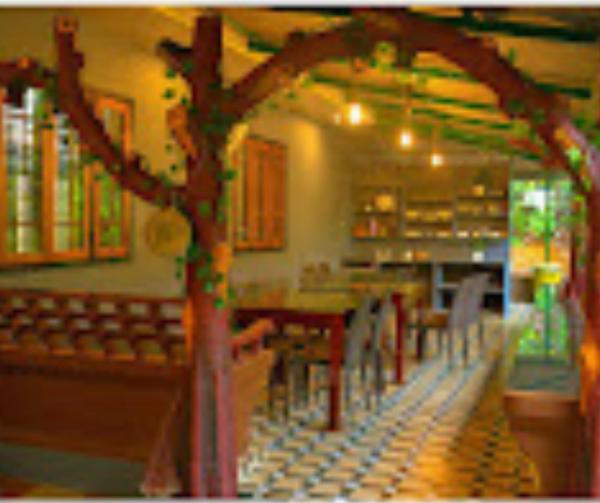 The photo shows the Holy Village Homestay located in the city of Neriyamangalam.