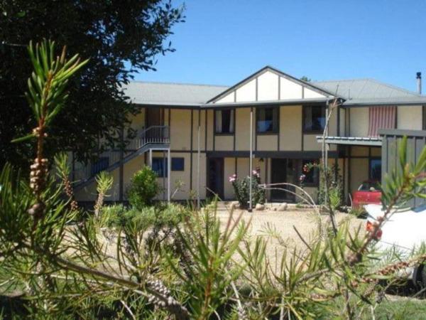The photo shows the Alpzview Guesthouse located in the city of Tawonga.