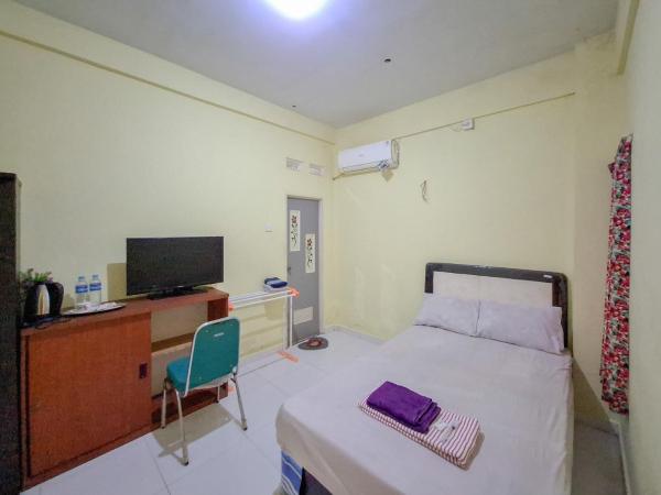 写真にはKruwul市にあるSekapuk Indah Guest House Syariah Gresik RedPartnerが写っています。
