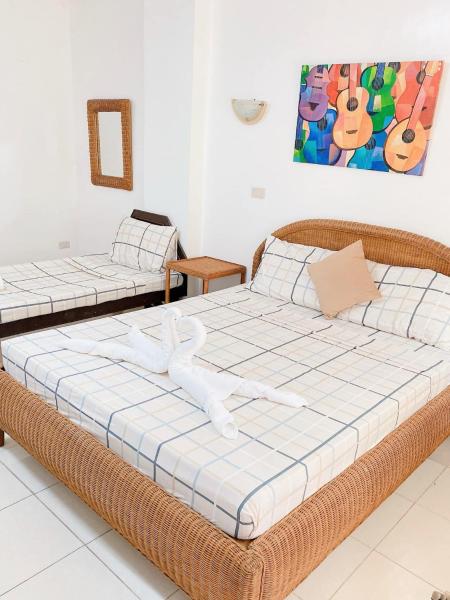 En la foto se muestra el objeto Happy Home Hotel Beachfront ubicado en la ciudad de Cabangusan.