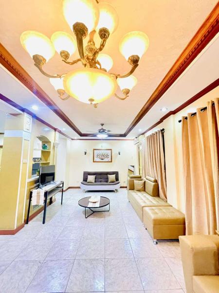 A la foto es mostra l'objecte Per Room Booking Host Homes Apitong 3BR Apartelle situat a la ciutat de Utap.