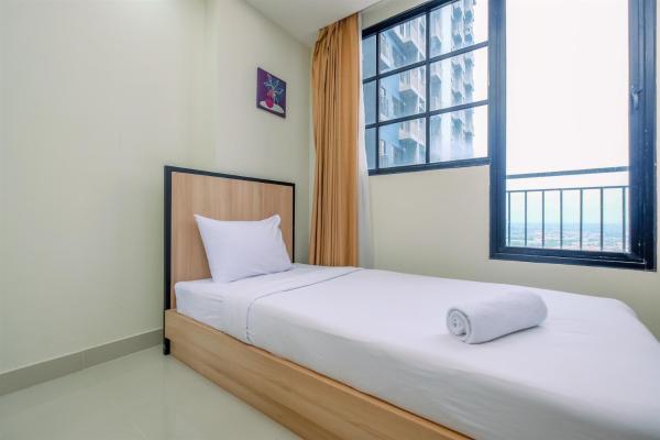Bild 2: Nice 2BR at 26th Floor Evenciio Margonda Apartment By Travelio