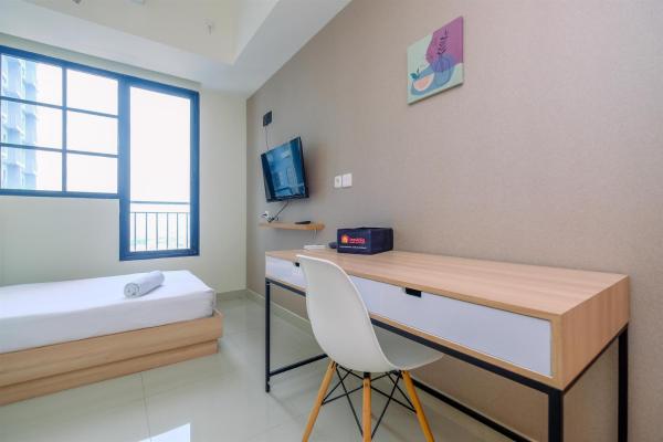 Bild 3: Nice 2BR at 26th Floor Evenciio Margonda Apartment By Travelio