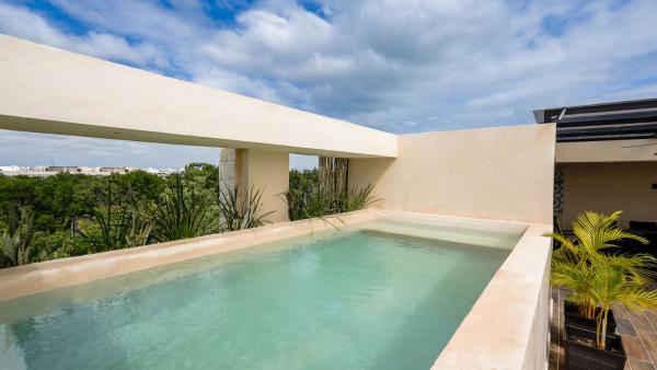 Na zdjęciu widoczny jest obiekt Sunset Serenity - Amply Private Terrace & Pool & Gym & Beach club access położony w mieście Tulum.