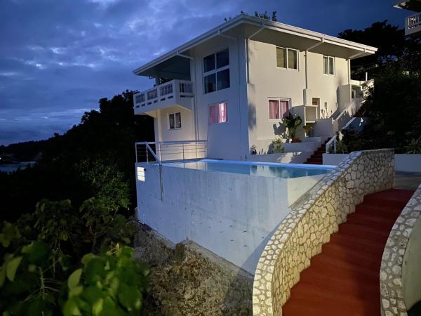 A la foto es mostra l'objecte April Villa - Luxury 2 Bed, 2 Bath Apartment with Panoramic Ocean Views, Peaceful, Private Beach situat a la ciutat de Tabugon.