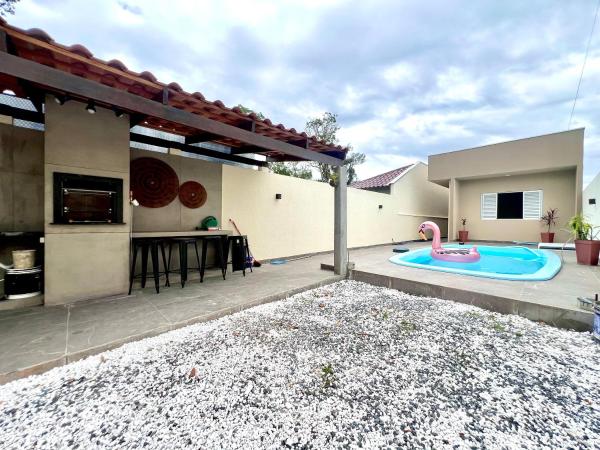 Na fotografii je vidět objekt Casa com piscina , ar condicionado e churrasqueira no balneário Eliana nacházející se ve městě Brejatuba.