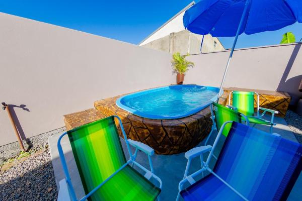 Na fotografii je vidět objekt Apartamento térreo próximo praia mercado farmácia nacházející se ve městě Imbituba.