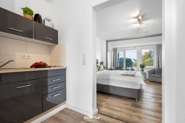 The photo shows the Apartment 23 located in the city of Kopperby.