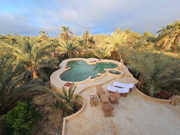 På billedet ses objektet Paradise in a palm forest with epic pool and fire pit beliggende i byen Siwa.